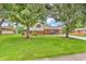 Traditional two-story home with brick and siding, mature trees, and a welcoming front porch at 2823 Tulip Dr, Indianapolis, IN 46227