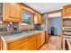 Close up of kitchen cabinetry with view into adjoining room at 2823 Tulip Dr, Indianapolis, IN 46227