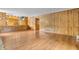 Spacious living room with wood-look floors and wood paneled walls at 2823 Tulip Dr, Indianapolis, IN 46227