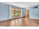 Spacious living room with wood floors, bright window, and neutral color paint create a welcoming atmosphere at 2823 Tulip Dr, Indianapolis, IN 46227