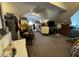 Spacious attic bedroom featuring hardwood furniture, a window, and a cozy, carpeted floor at 3054 Ruckle St, Indianapolis, IN 46205
