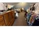 Open attic bedroom with slanted ceilings, showcasing a bed, dresser, and built-in closet space at 3054 Ruckle St, Indianapolis, IN 46205