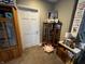 Finished attic space with carpet, a wooden cabinet, and door; perfect for flexible living at 3054 Ruckle St, Indianapolis, IN 46205