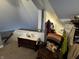 Attic room featuring a wooden trunk with an ivory covering, a comfortable chair, and cozy decorations at 3054 Ruckle St, Indianapolis, IN 46205