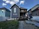 Backyard with a two-story home featuring a deck, patio area with furniture, and a small grassy area at 3054 Ruckle St, Indianapolis, IN 46205