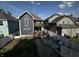 Backyard with a multi-level wooden deck, stone patio, lawn, and surrounding privacy fence at 3054 Ruckle St, Indianapolis, IN 46205