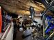Unfinished basement area with exercise equipment and access to the garage at 3054 Ruckle St, Indianapolis, IN 46205