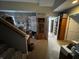 Finished basement space with stairs, doorway and comfortable seating area at 3054 Ruckle St, Indianapolis, IN 46205