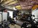 Unfinished basement area with exercise equipment and access to the garage at 3054 Ruckle St, Indianapolis, IN 46205