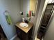 Bathroom vanity with sink, mirror, and a cabinet for storage at 3054 Ruckle St, Indianapolis, IN 46205