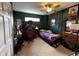 A music-themed bedroom featuring carpet flooring and green walls at 3054 Ruckle St, Indianapolis, IN 46205