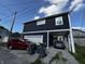 Exterior showing a two car garage and a two car port, plus off-street parking at 3054 Ruckle St, Indianapolis, IN 46205