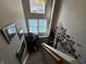 Bright stairway with decor, including framed photos and a Gathering tree wall decal at 3054 Ruckle St, Indianapolis, IN 46205