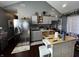Bright kitchen features stainless steel appliances, wooden island and grey cabinets at 3054 Ruckle St, Indianapolis, IN 46205