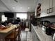 Kitchen with breakfast bar, recessed lighting, hardwood floors and marble countertops at 3054 Ruckle St, Indianapolis, IN 46205