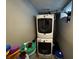 Laundry area with stacked washer and dryer units at 3054 Ruckle St, Indianapolis, IN 46205