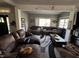 Spacious living room with a large sectional sofa, a patterned rug, and natural light at 3054 Ruckle St, Indianapolis, IN 46205