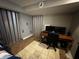 Home office with a desk, monitor, and tiled floors at 3054 Ruckle St, Indianapolis, IN 46205
