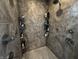 Walk-in shower with tiled walls, a handheld showerhead and recessed shelving at 3054 Ruckle St, Indianapolis, IN 46205