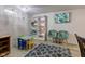 Basement playroom area featuring shelving, play table, seating and lots of room to play at 315 W 43Rd St, Indianapolis, IN 46208