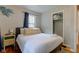 Cozy bedroom with queen bed, closet, and hardwood floors at 315 W 43Rd St, Indianapolis, IN 46208