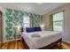 Bedroom featuring tropical wallpaper and a queen bed at 315 W 43Rd St, Indianapolis, IN 46208