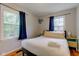 Bedroom with a queen bed, wood floors, and lots of natural light from two windows at 315 W 43Rd St, Indianapolis, IN 46208