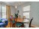 Bright dining room with hardwood floors, comfortable seating, and stylish light fixtures at 315 W 43Rd St, Indianapolis, IN 46208
