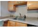 Kitchen sink with a window and wood cabinets at 315 W 43Rd St, Indianapolis, IN 46208