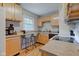 Cozy kitchen with wood cabinets, eat-in counter, and modern appliances at 315 W 43Rd St, Indianapolis, IN 46208