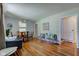 Cozy living room with hardwood floors, stylish wallpaper, and a bright, inviting atmosphere at 315 W 43Rd St, Indianapolis, IN 46208