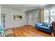 Comfortable living area featuring hardwood floors, a modern TV, and stylish decor at 315 W 43Rd St, Indianapolis, IN 46208