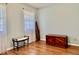 Bright bedroom with wood floors, curtains, and natural light at 3418 S Rosewind Dr, New Palestine, IN 46163
