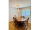 Formal dining room featuring a wooden table with seating for six and a classic chandelier at 3418 S Rosewind Dr, New Palestine, IN 46163