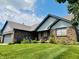 Charming single-story home with a brick exterior, a well-manicured lawn and a two car garage at 3418 S Rosewind Dr, New Palestine, IN 46163
