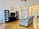 Bright living area with hardwood floors and vaulted ceilings, and minimal staging at 3418 S Rosewind Dr, New Palestine, IN 46163