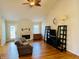 Cozy living room featuring vaulted ceilings, hardwood floors and a fireplace at 3418 S Rosewind Dr, New Palestine, IN 46163
