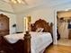 Inviting main bedroom features hardwood floors, a large bed, and a walk-in closet at 3418 S Rosewind Dr, New Palestine, IN 46163
