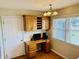 Home office featuring oak cabinetry, desk, and a window providing natural light at 3418 S Rosewind Dr, New Palestine, IN 46163