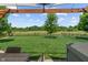 Expansive backyard oasis featuring lush lawn, mature shade tree and beautiful views beyond the property line at 3420 Stoddard Pl, Indianapolis, IN 46217