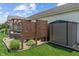 Landscaped backyard featuring a shed, hot tub, pergola, and patio seating and landscaped flowerbed at 3420 Stoddard Pl, Indianapolis, IN 46217
