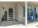 Close-up of a quaint front porch, featuring a welcoming bench, decorative shutters, and a stylish 'Welcome' sign at 3420 Stoddard Pl, Indianapolis, IN 46217