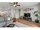 Inviting living room with a large TV, comfortable seating, and ample natural light at 3420 Stoddard Pl, Indianapolis, IN 46217