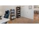 Office space featuring a bookcase, shelving and storage, and a printer, and an adjacent room beyond at 3420 Stoddard Pl, Indianapolis, IN 46217