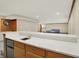 Finished basement boasts a wet bar with a quartz countertop and natural wood cabinets at 369 Rodeo Dr, Indianapolis, IN 46217