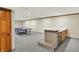 Finished basement featuring recreational area with a wet bar and ping pong table at 369 Rodeo Dr, Indianapolis, IN 46217