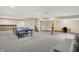Finished basement offering a spacious recreation area with recessed lighting and plush carpeting at 369 Rodeo Dr, Indianapolis, IN 46217
