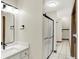 Bathroom featuring modern vanity with sleek fixtures and glass-enclosed shower at 369 Rodeo Dr, Indianapolis, IN 46217