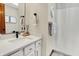Modern bathroom with updated fixtures, white cabinets, and a shower with a curtain at 369 Rodeo Dr, Indianapolis, IN 46217