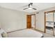 Comfortable bedroom features a ceiling fan, neutral decor, and ample closet space at 369 Rodeo Dr, Indianapolis, IN 46217
